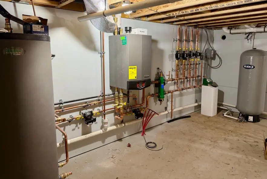Basement with heating system and pipes.