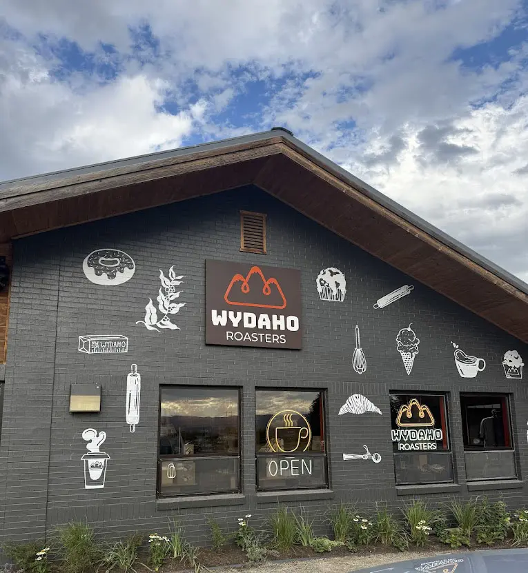 Cafe exterior with decorative wall art.